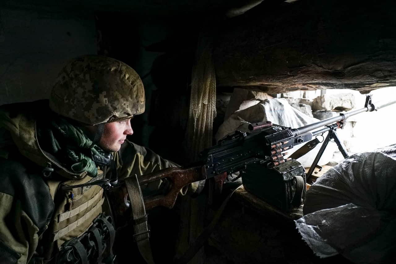 A Ukrainian soldier looks from his position near the frontline with Russia-backed separatists in Shyrokyne, eastern Ukraine