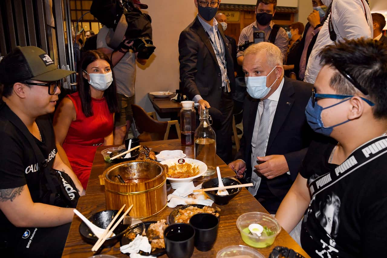 Liberal Member for Reid Fiona Martin (second left) and Prime Minister Scott Morrison meet during a Lunar New Year Street Walk in Burwood Chinatown.