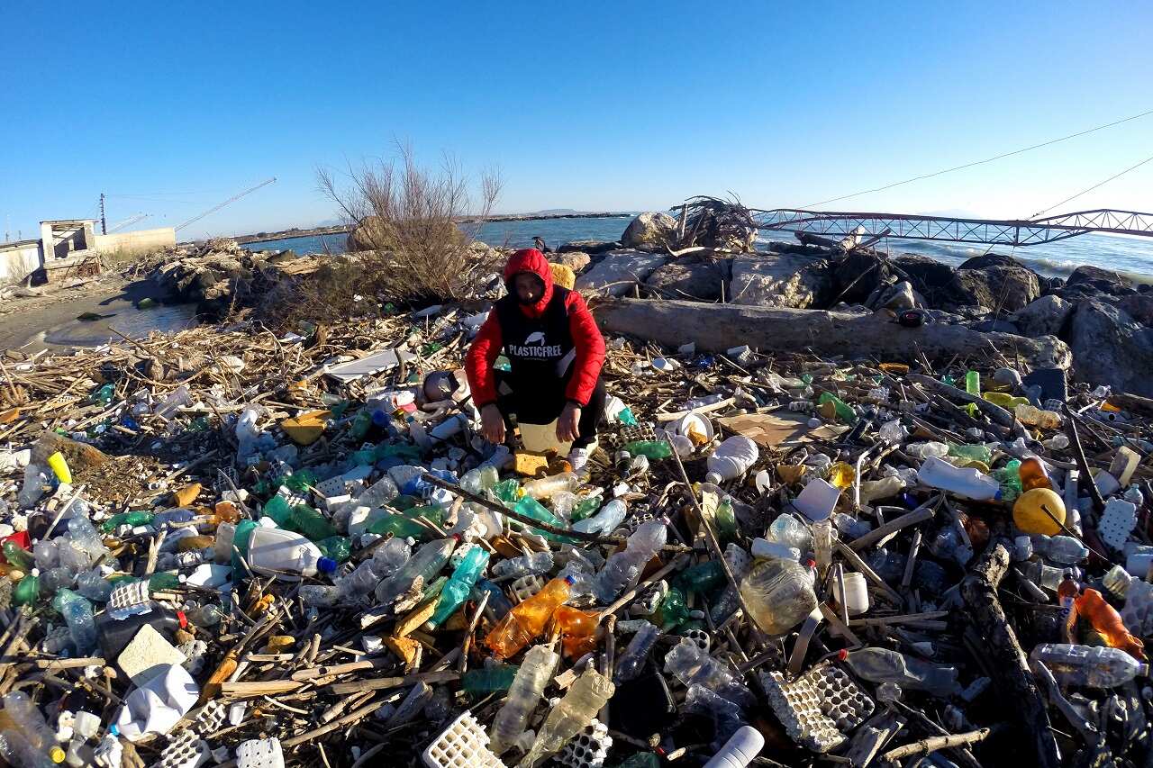 Volunteers of the Plastic Free association, clean up the "Plastic Beach" of Volturno, Italy.
