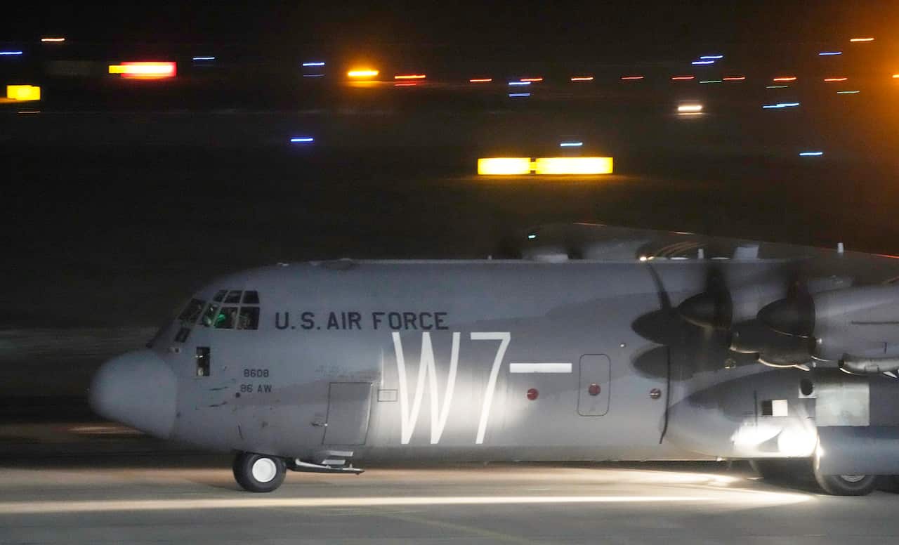 A U.S. Army transport plane with military equipment just after landing 