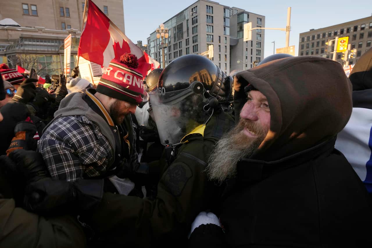 Protesters meet police in close quarters as authorities take action to put an end to a protest.