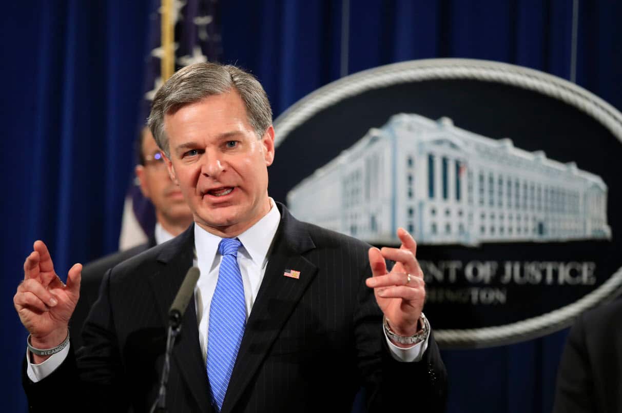 FBI Director Christopher Wray speaks during a news conference at the Department of Justice
