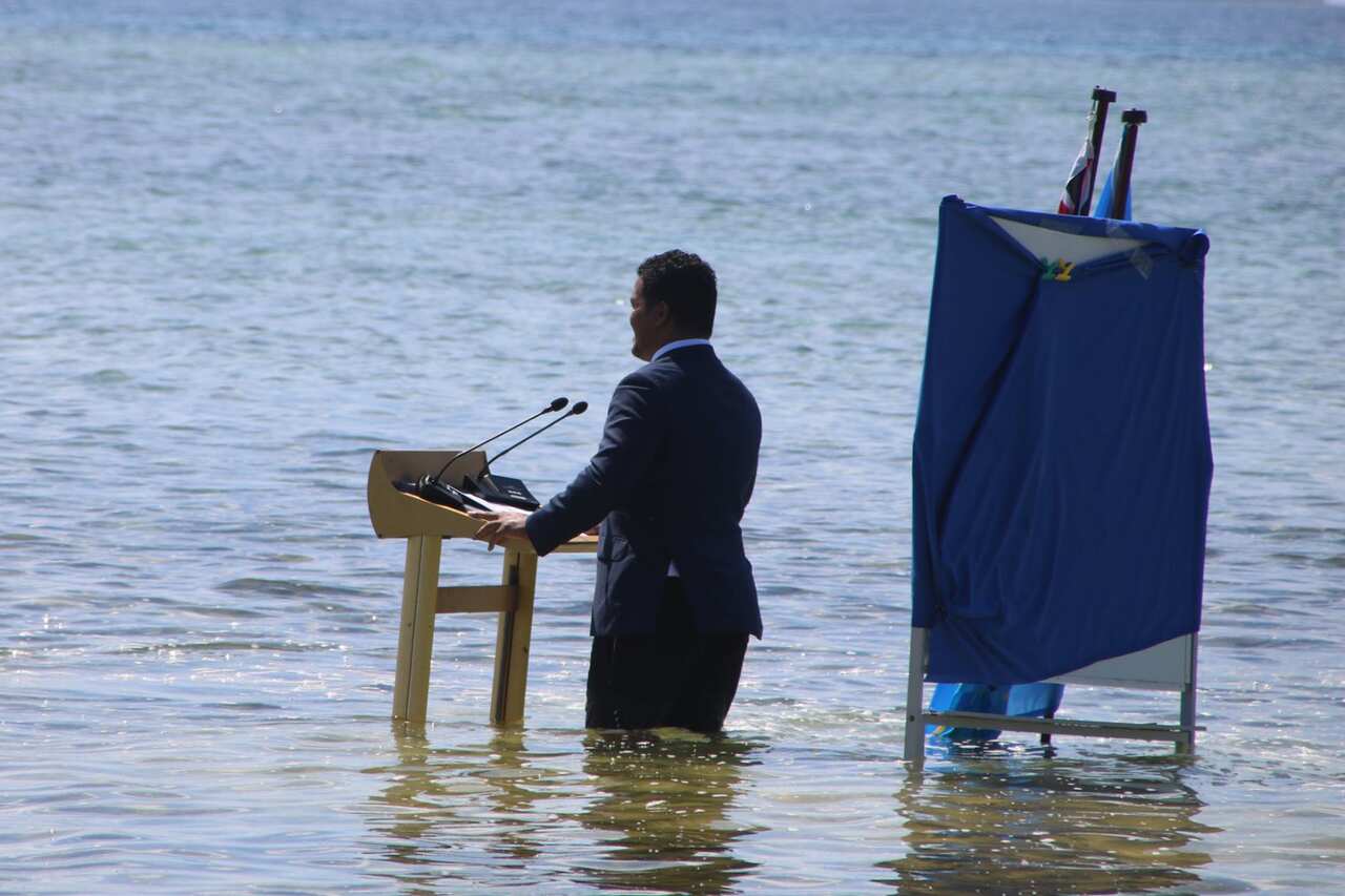 In a pre-recorded event, Fijian Foreign Minister Simon Kofe addresses COP26 from the ocean.