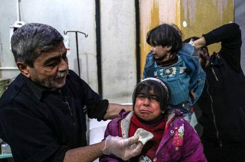 Injured children receive medical attention inside a hospital after bombing, rebels-held Douma, Eastern Ghouta, 22 February 2018