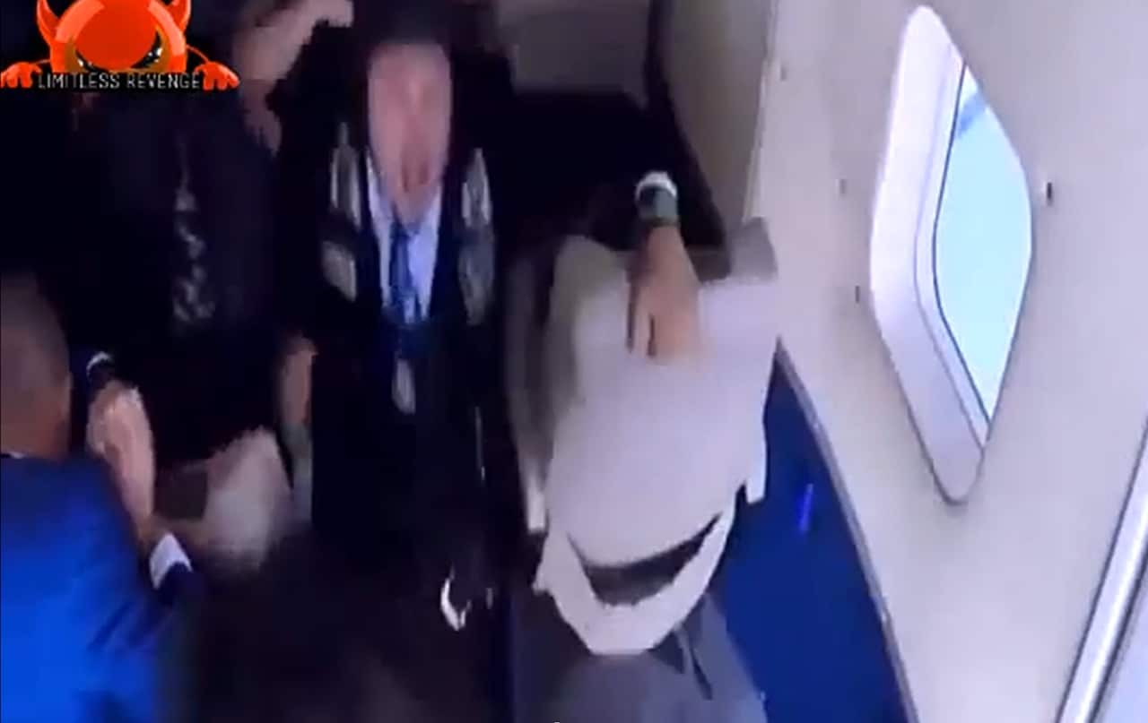 A man appears to be pulled from a plane during a TV prank (Ramez in Control).
