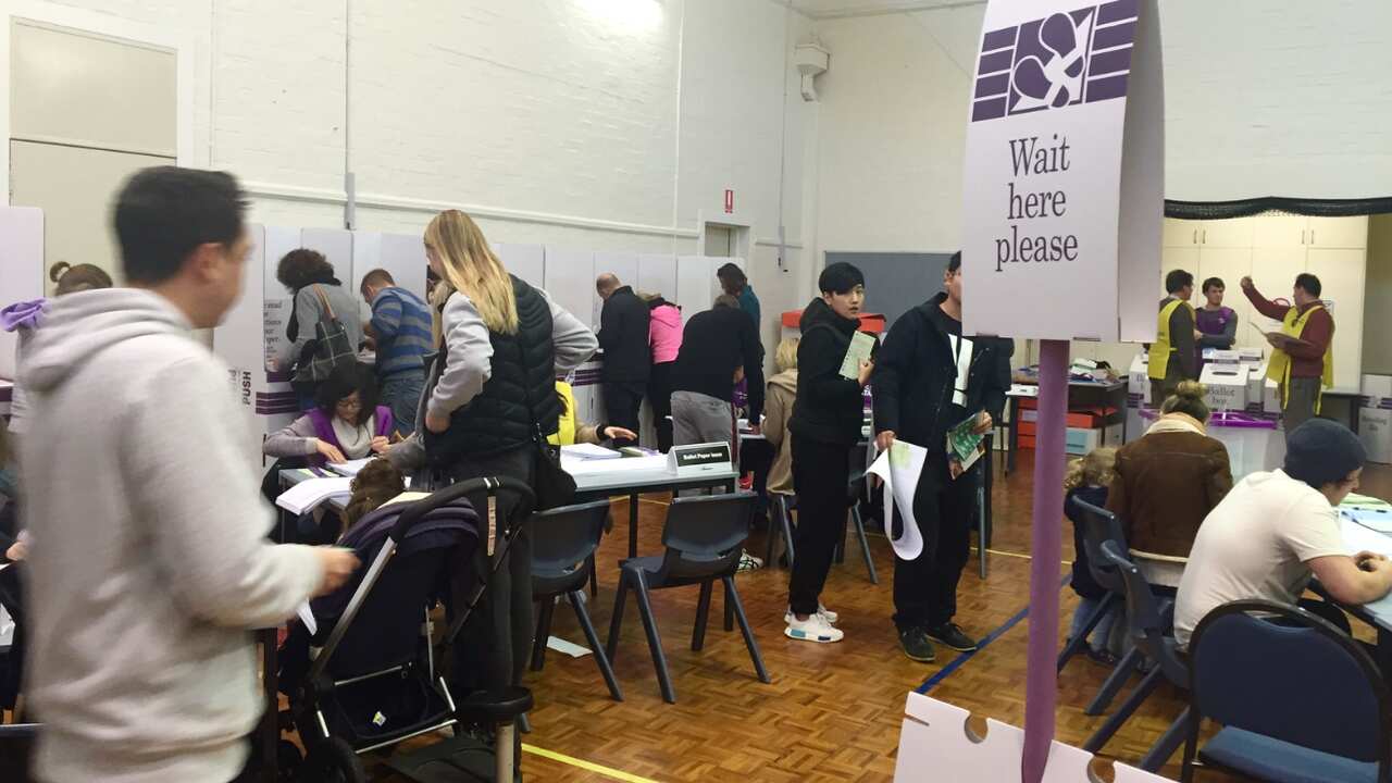 Inside a busy election booth. 