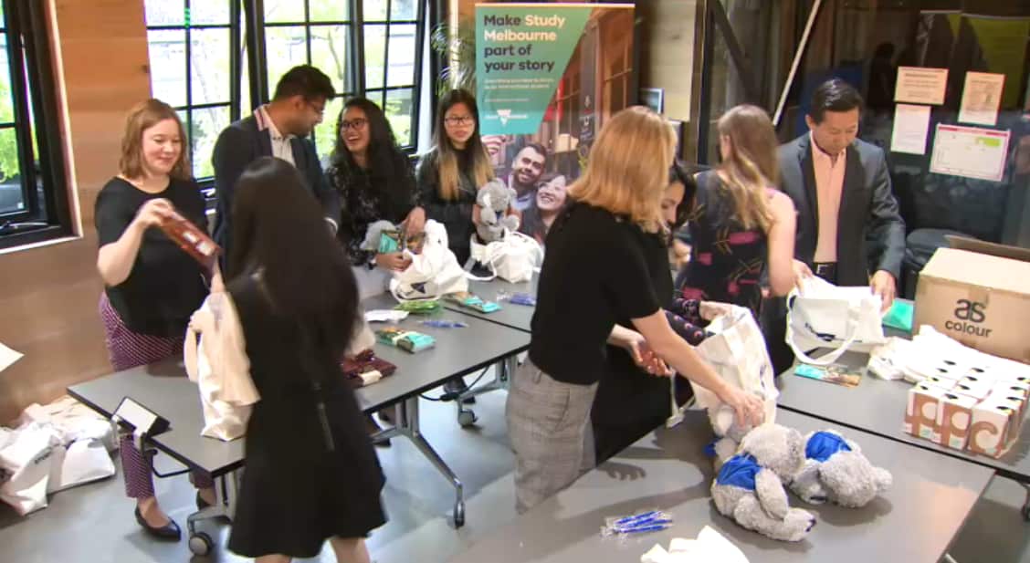 The volunteers work on the care packages.