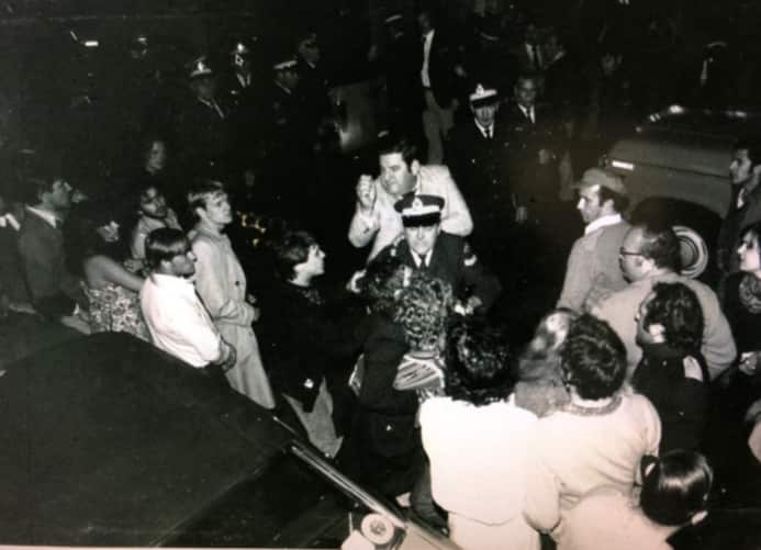 Police confront participants.