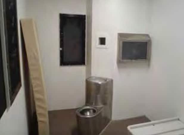 An image of an "isolation cell" featured in the report.