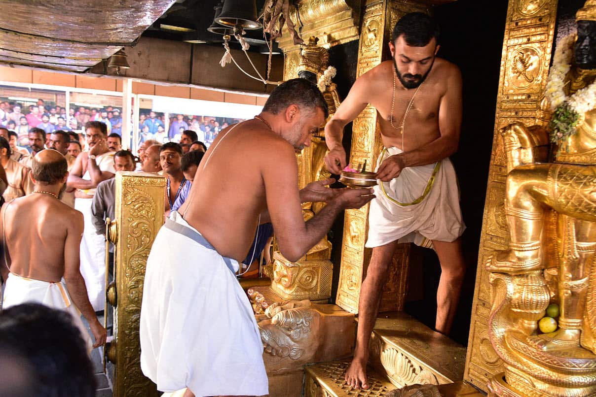 Indian persist perform the rituals inside the Sabarimala temple in Kerala