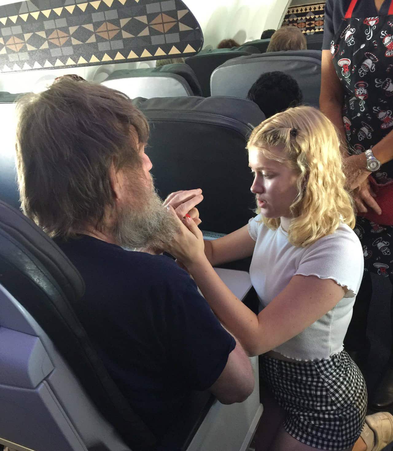 A California teen stepped up to help a blind and deaf man who was alone on a flight and needed help communicating.