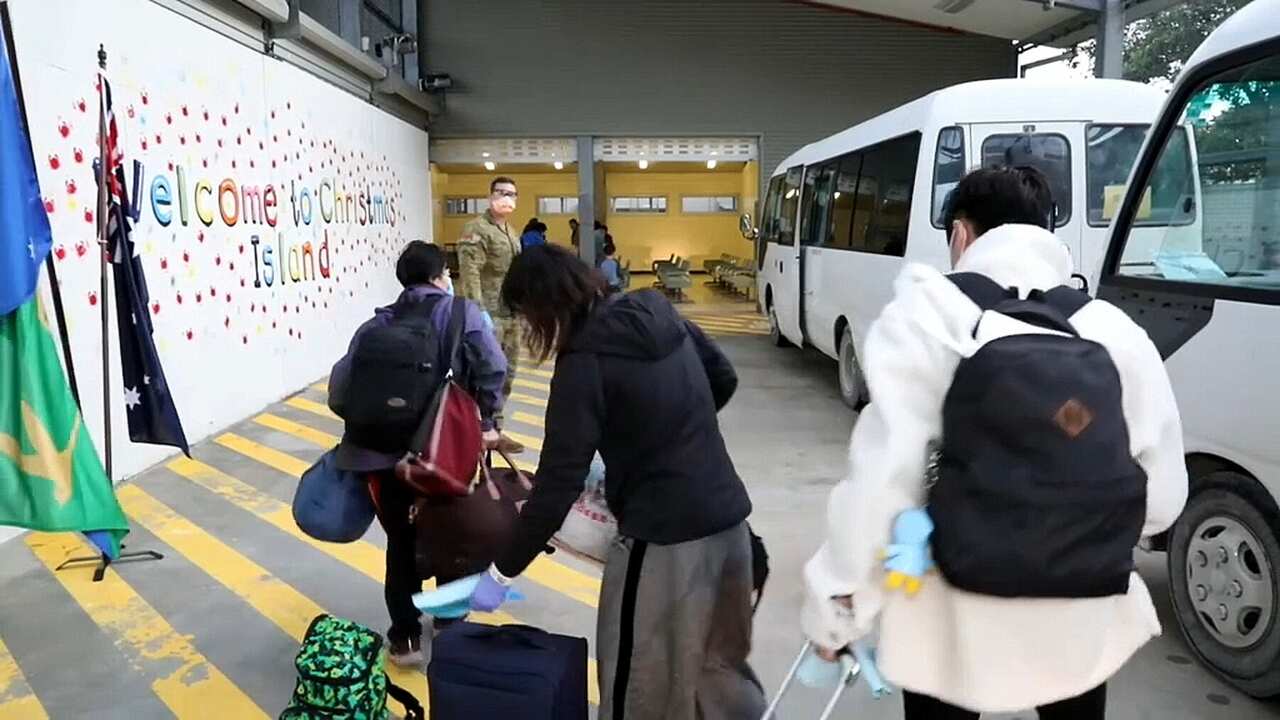 A group of Wuhan evacuees arrive at Christmas Island.