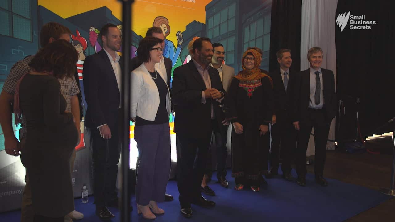 Philip Dalidakis (centre) introduces representatives from nine small businesses chosen to be festival ambassadors.
