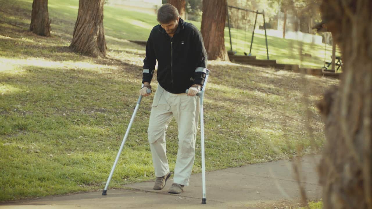 After years of rehabilitation, James was able to take his first steps again. (Grainger Films)