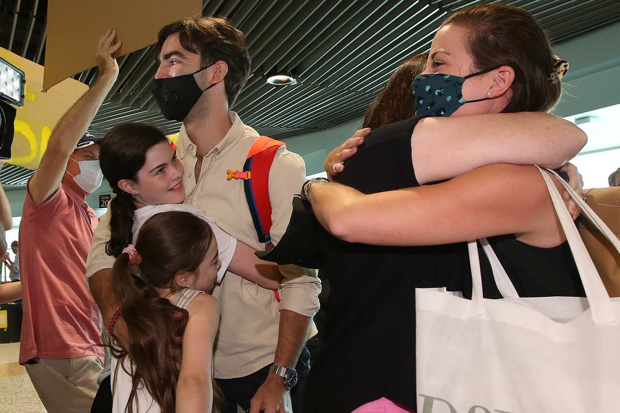 Travellers arrive in Brisbane from Sydney.