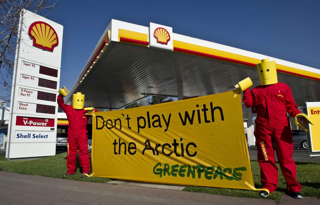 Greenpeace activists dressed as Lego characters protest in front of a Shell gas station in Santiago, Chile.