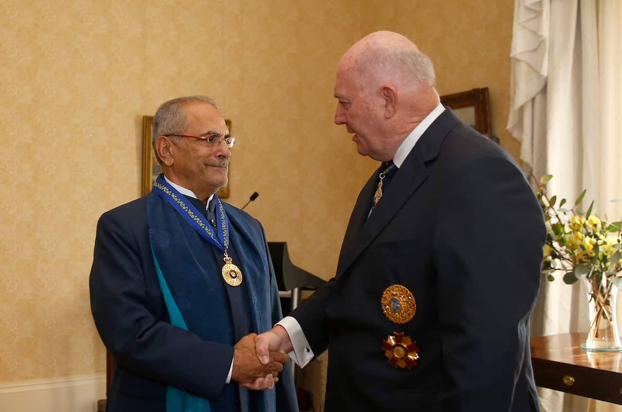 Jose Ramos-Horta and Australian Governor-General Peter Cosgrove shake hands during Ramos-Horta's Investiture Ceremony at Kirribilli House.