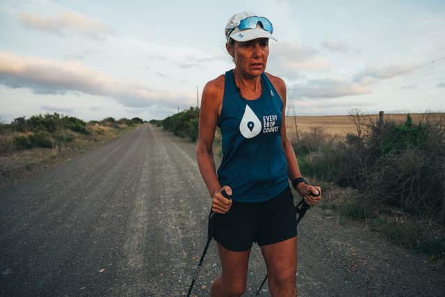 Mina Guli using walking sticks to complete a marathon due to injury between Mossel Bay and Riverdale in South Africa.