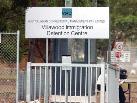 A sign which reads 'Villawood Immigration Detention Centre'.