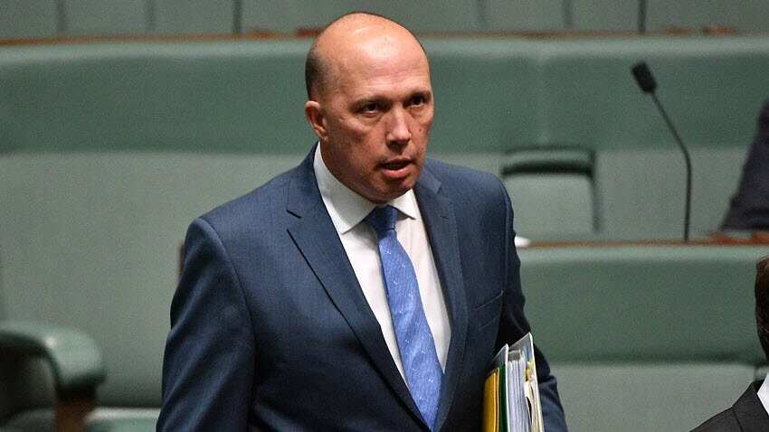 Minister for Home Affairs Peter Dutton leaves Question Time in the House of Representatives. 