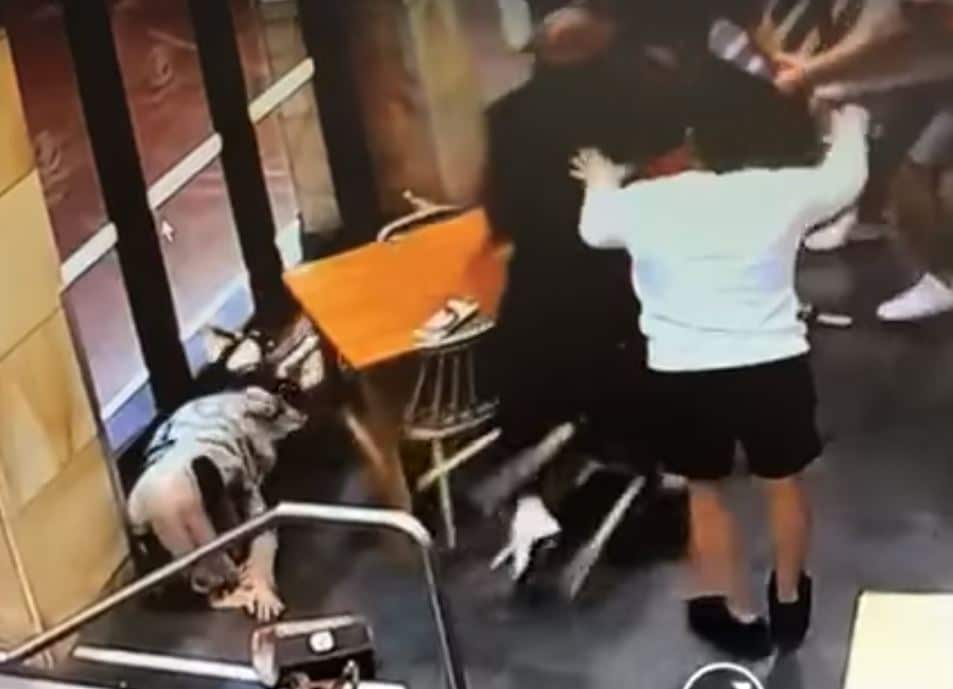 The pregnant woman is seen on the ground in the CCTV after the alleged attack.