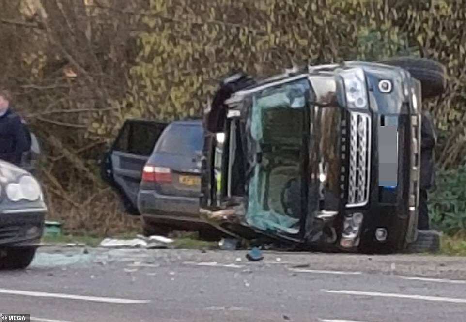 Prince Philip is 'conscious but very shocked and shaken' after a dramatic crash near his Sandringham Estate which left two women in the other vehicle in hospital and the Land Rover he was driving on its side in a crumpled heap