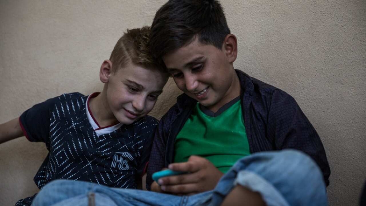 Emad Tammo (left) with his cousin in Dohuk, Kurdistan Region of Iraq.