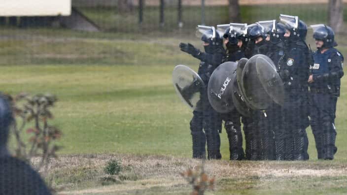 Riot police are seen during a riot at the Frank Baxter Juvenile Justice Centre.