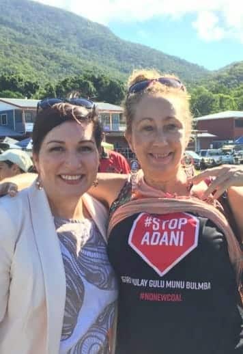 Queensland Environment Minister Leanne Enoch poses with a Stop Adani activist at an Indigenous festival near Cairns. 