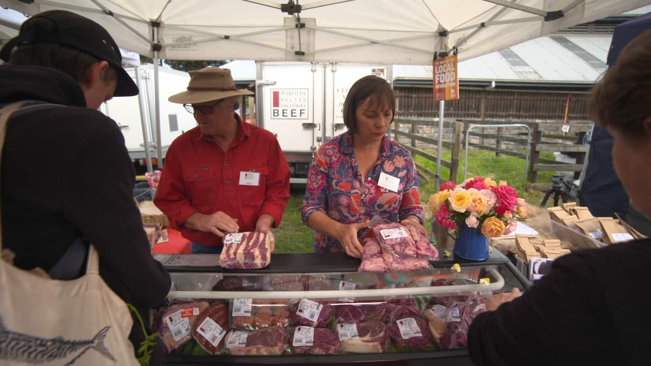 Allen and Lizette at the local farmers market with their produce.