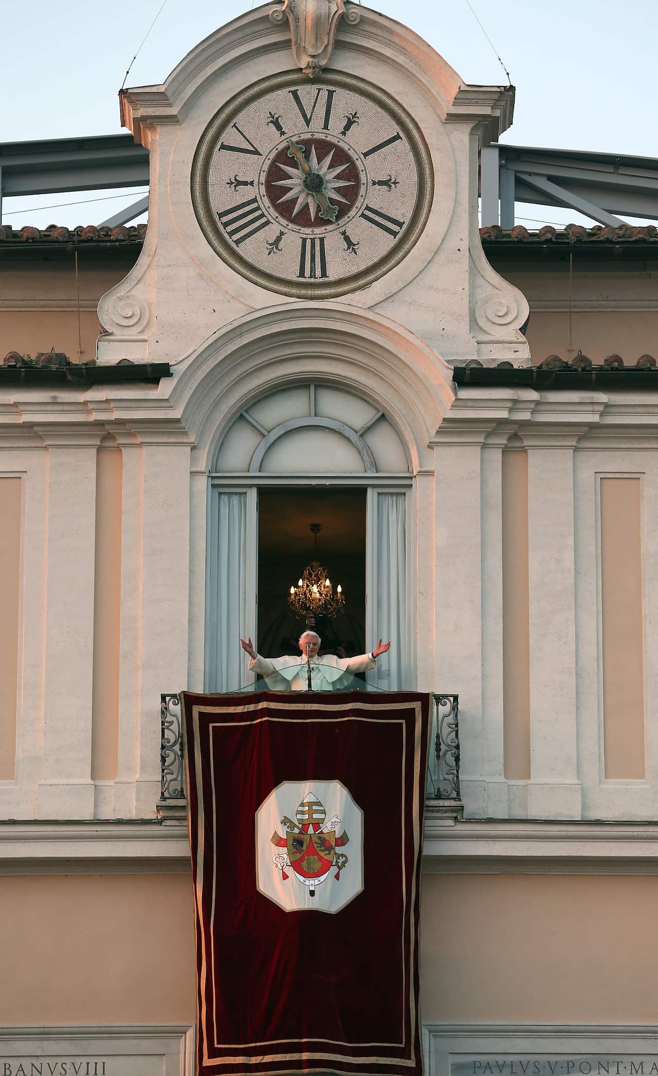 Pope Benedict XVI waves to pilgrims for the last time as head of the Catholic Church.