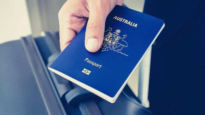 A person holding an Australian passport.