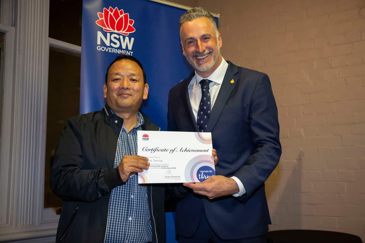 Mr Tsering receives his certificate from Mr Sidoti.