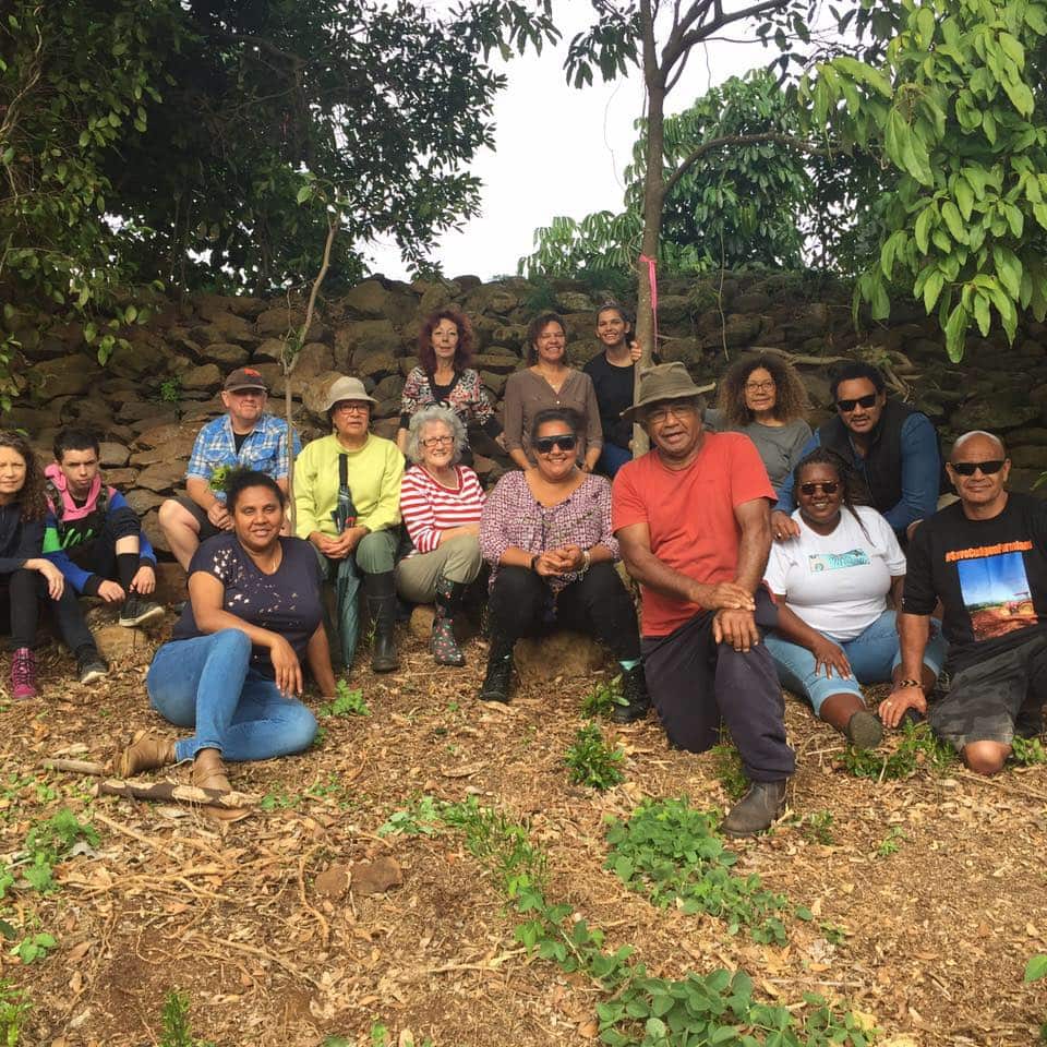 Tweed Vally South Sea Islanders pose with dry stone wall on hospital site before construction began.