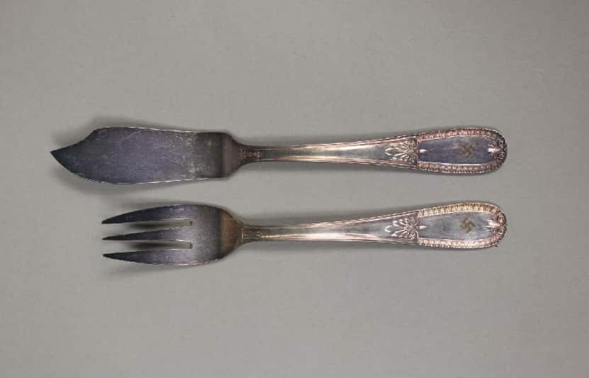 Fish serving fork and lifter, "each marked with Nazi Swastika symbol".