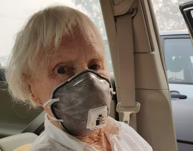 ... Sobott wearing a mask to protect herself from smoke inhalation.