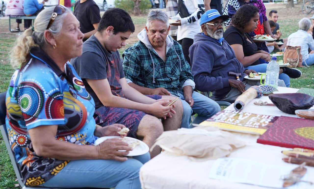 Eddy Harris swaps stories on the banks of the river with Barkindji elders and says his art helps him express his feelings about the devastating state of the river.