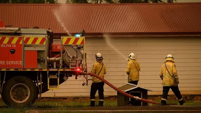 NSW Rural Fire Service crews protect property as the Gospers Mountain Fire approaches Bilpin in December.
