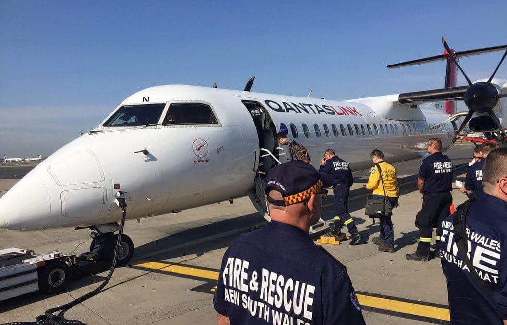 Fire and Rescue firefighters board a plane bound the fire zone. 