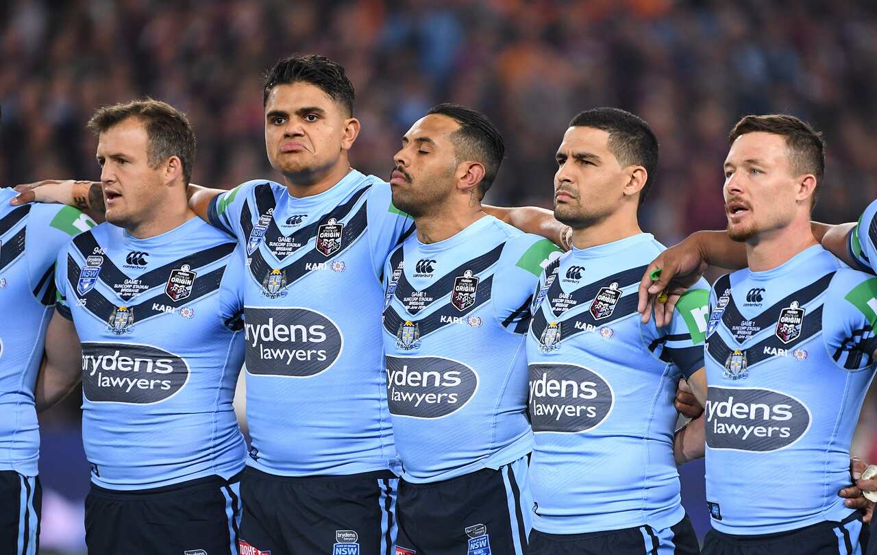  Latrell Mitchell, Josh Addo-Carr Cody Walker during the Australian National Anthem prior to Game 1 of the 2019 State of Origin series. 