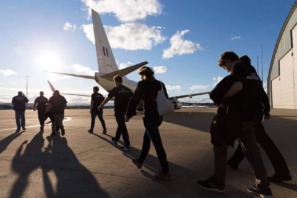 Rural Fire Service volunteers prepare to board a plane ahead of Tuesday's catastrophic fire danger.
