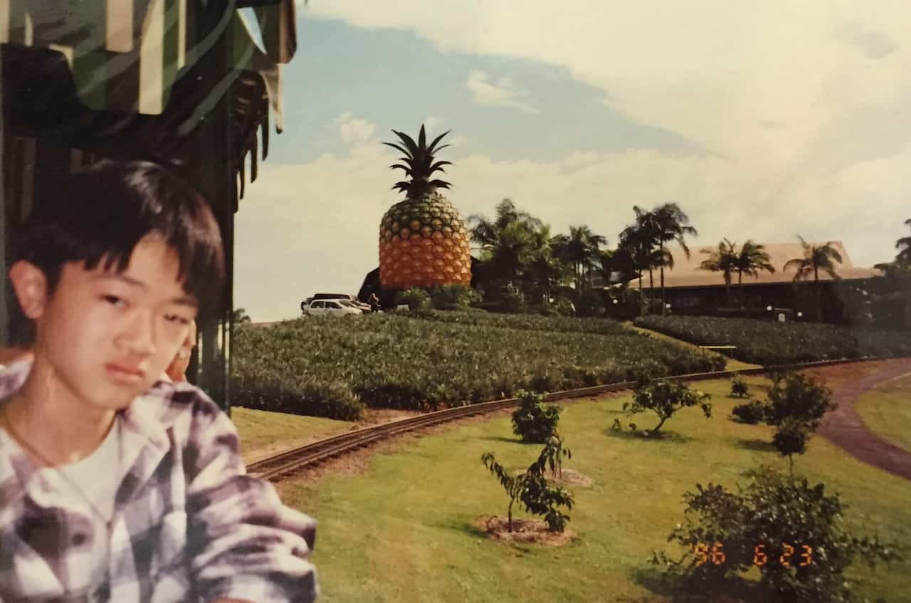 A young Benjamin Law 'enjoying' a theme park outing.