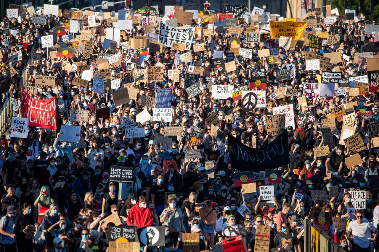 Protesters participate in a Black Lives Matter rally in Brisbane