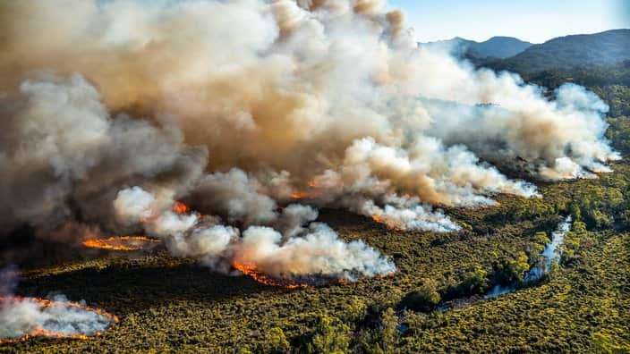  large bushfire burning in Tasmania, Australia. Some 55,0000 hectares of wilderness and bushland across the state has been ravaged by scores of fires, at least one of which has been burning since late December. 