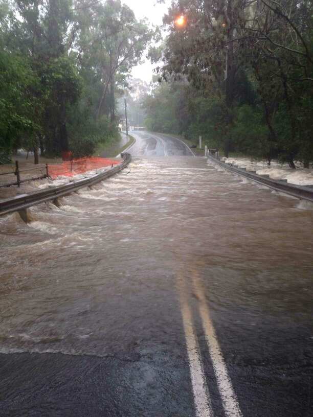 Flash flooding has been reported across the Gold Coast and parts of Brisbane, with highways and roads cut off by water.