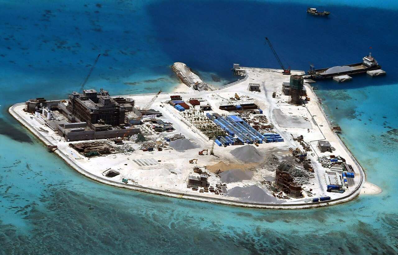 Construction at Mabini (Johnson) Reef by China, in the disputed Spratley Islands, in the south China Sea (AAP)
