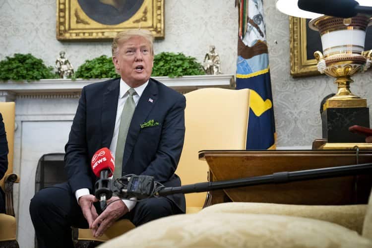 US President Donald Trump says he was "never a fan" of John McCain.