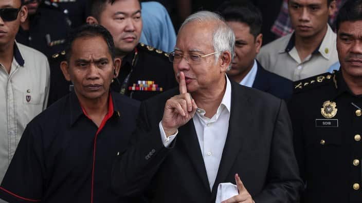 Former Malaysia prime minister Najib Razak leaves the Malaysian Anti-Corruption Commission headquarters in Putrajaya (AAP)