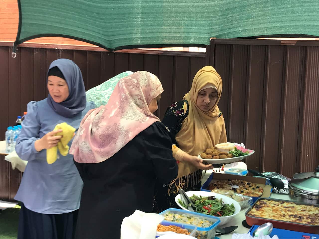 Women enjoying and end of term feast at IWWC