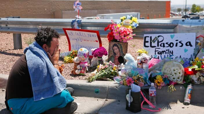 August 4, 2019; El Paso, TX, USA; Felipe Avila mourns outside Walmart in El Paso August 4, 2019
